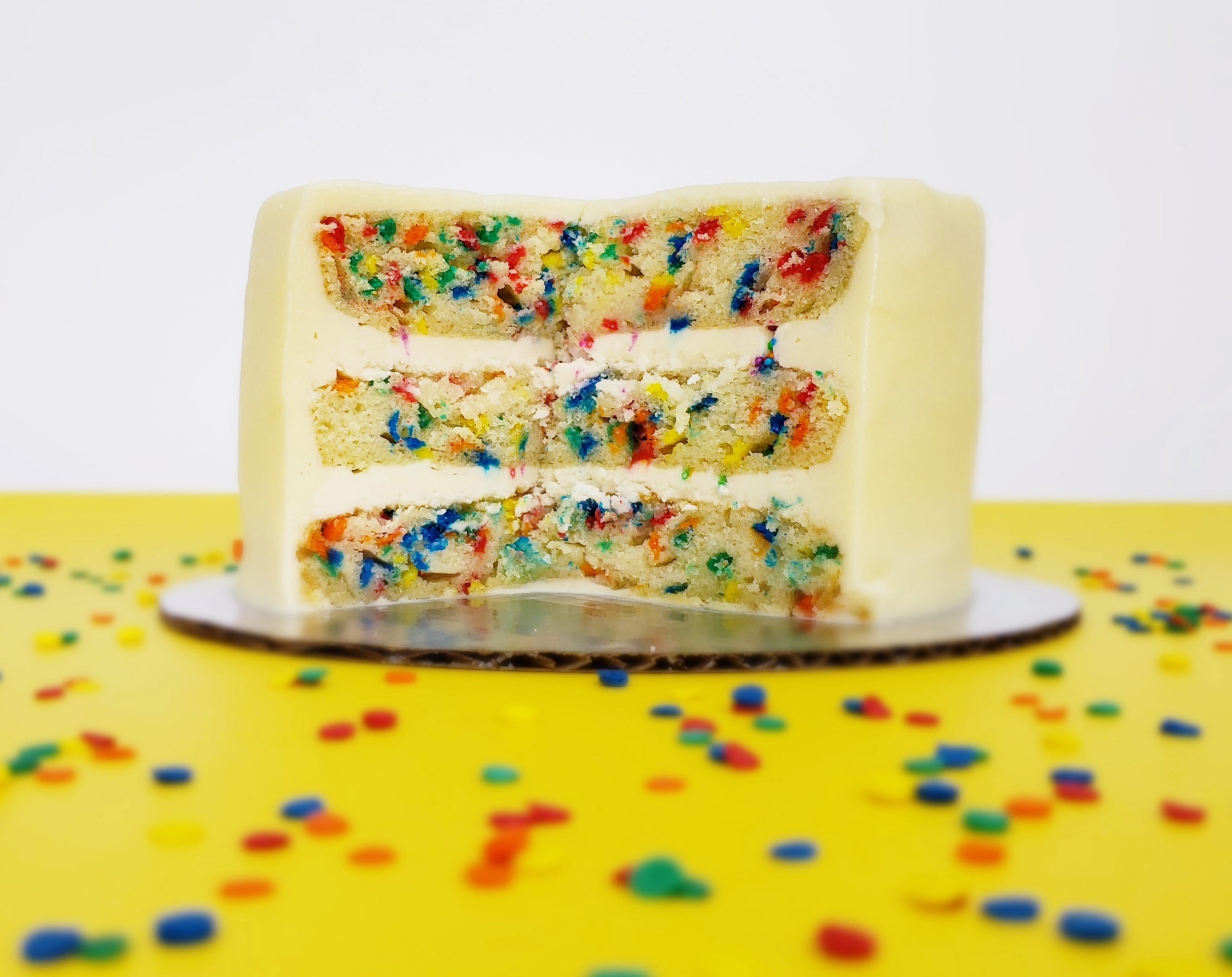 Fetti layer cake with sprinkles baked inside ready for DIY cake decorating at Cake Hoopla in the Portland area.