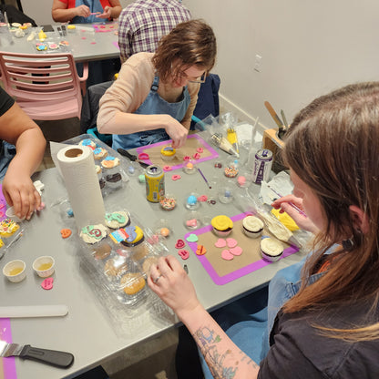 An adult couple enjoying Valentine's Day cupcake-decorating at Cake Hoopla in Tigard, Oregon near Portland.