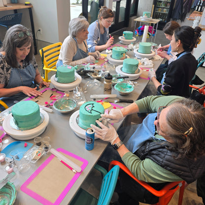 A group of women work on bird-themed cakes during a private lesson at Cake Hoopla in Tigard, Oregon near Portland.