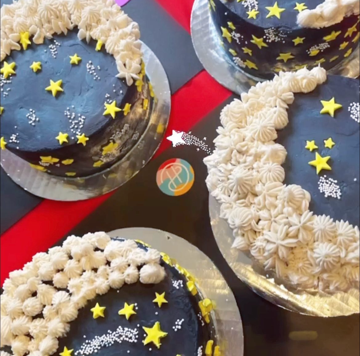 Four finished To the Moon cakes decorated during an adult party in the Portland area. Each unique and using slightly different piping techniques for the moon, but pretty and closely resembling the  intended design.